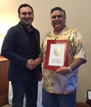Image of Rogelio Caudillo presenting a Senate Certificate to California Highway Patrol Officer Bill O'Dell