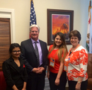 Image of Andy with three girls from Hanford on the scavenger hunt.