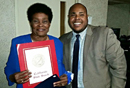 Image of Team Vidak’s Michael Bowers presenting a Senate Certificate to Ulice Reid in celebration of her 80th Birthday and in recognition for her community service.