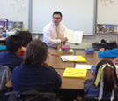 Image of Team Vidak’s Nathan Alonzo reading to 4th Grade Class at Wilson Elementary in Sanger.