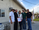 Image of Team Vidak's Paula Vinzant presenting a Senate Certificate recognizing the efforts of Tulare County Community partners.