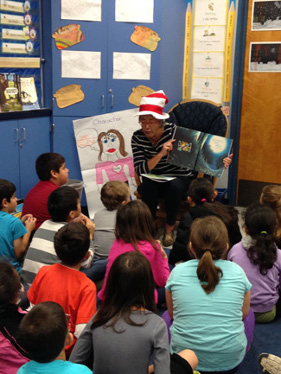 Image of Senator Liu reading to students