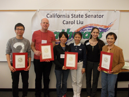 Image of Nareene Karakashian presenting certificates of recognition to certified Tzu Chi Foundation volunteer tax preparers