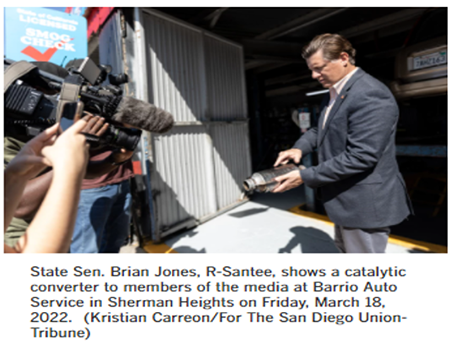 Senator Jones holding Catalytic_Converter